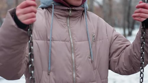 Young Woman on Swing in Winter Park