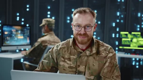 Military Soldier Programming Code Using Desktop Computer Smiling on ...