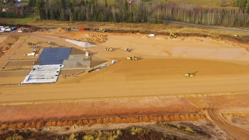 Construction site with leveling land and building foundation work