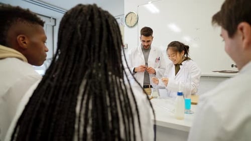 Science Students Conducting Chemistry Experiment in Classroom