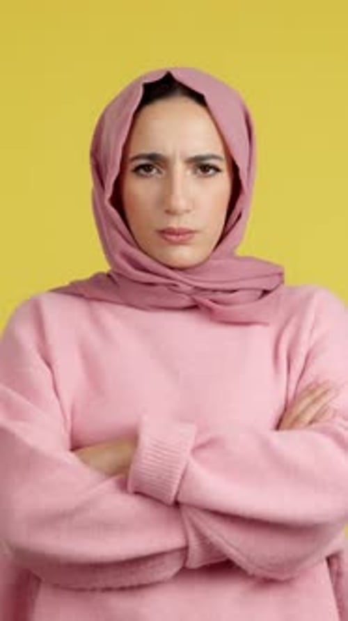 Muslim Woman Crossing the Arms with an Angry Expression