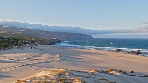 Revealing drone footage of the beautiful beach at sunrise
