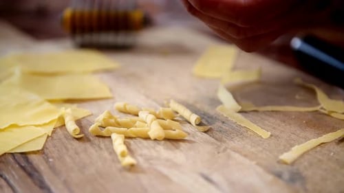 Making Garganelli Pasta: Rolling Pasta on Wooden Board