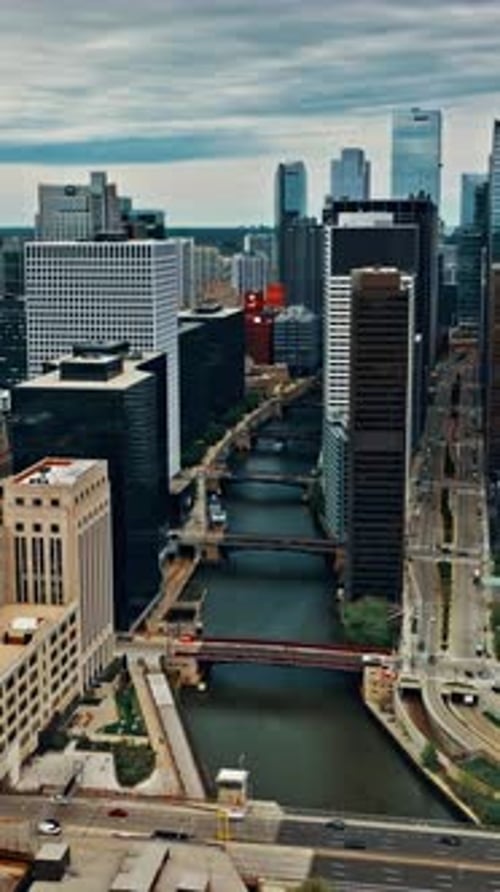 Aerial view of Chicago showcasing buildings and river flow