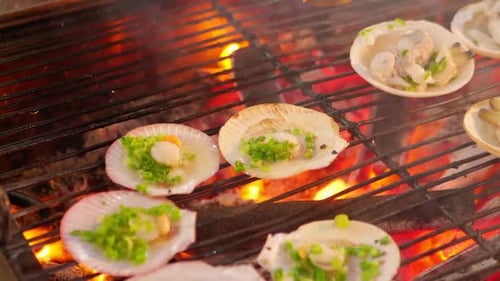 Grill mollusk, mussel cooking seafood street food and beach bbq Phu Quoc island, Vietnam.