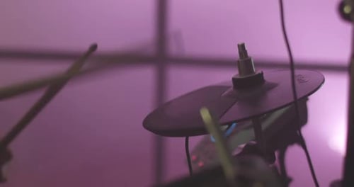 Close Up of Drum Cymbal with Drumsticks