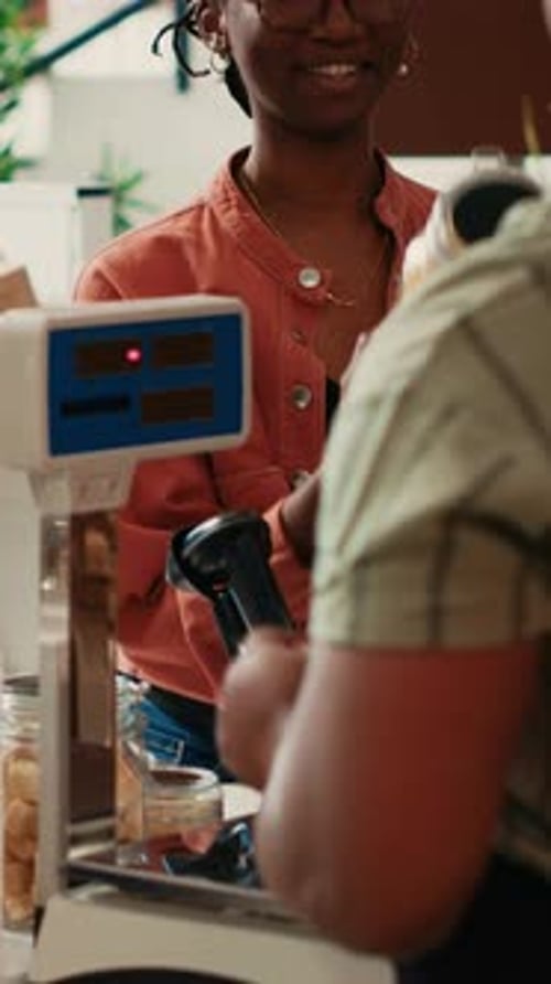 Vertical Video Organic Store Merchant Scanning Jars for Customer at Checkout