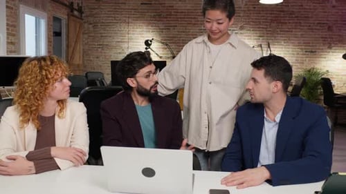 Team Discussing Ideas at Modern Workplace