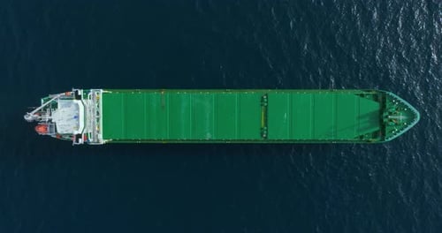 Top Down Aerial View Green Large General Cargo Ship Anchored at Sea