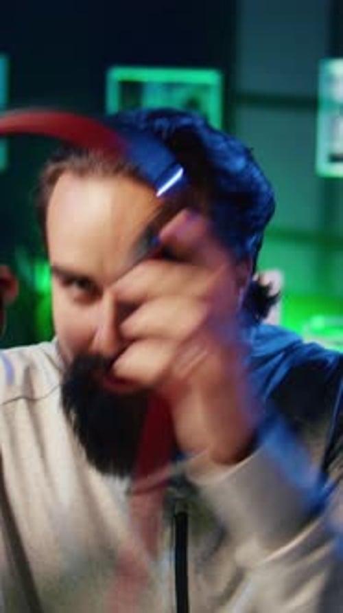 Vertical Video Close Up on Pro Gamer Playing Videogame Teaching Viewers Esports Strategies
