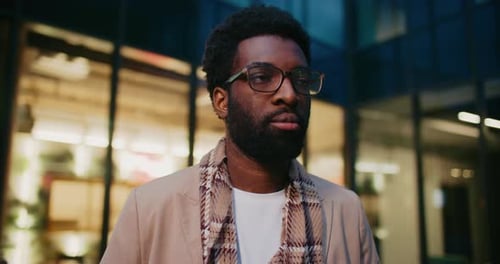 Attractive African American Man Standing Still and Looking at Something in Distance Bearded Male
