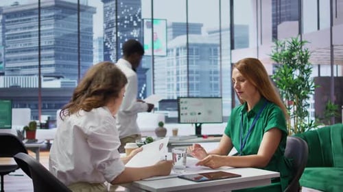 Team of Women Recruiters Selecting Candidates By Reviewing Their Resumes