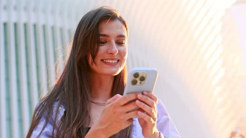 Happy Beautiful Girl Young Business Woman Walking in City Street Looking Into Mobile Phone