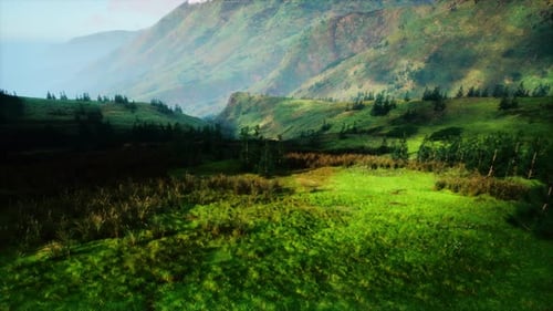 Serene Green Valley Encircled By Majestic Mountains