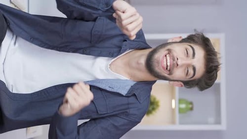 Vertical video of Happy man dancing.