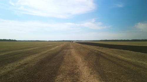 Tractors plowing the field in Ukraine