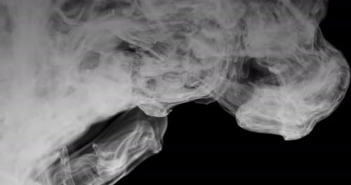 White Smoke Drifting on Black Background