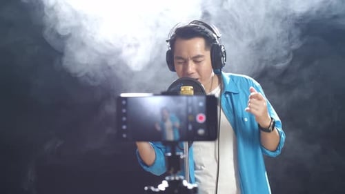 Singer Performing in a Smoke-Filled Music Studio