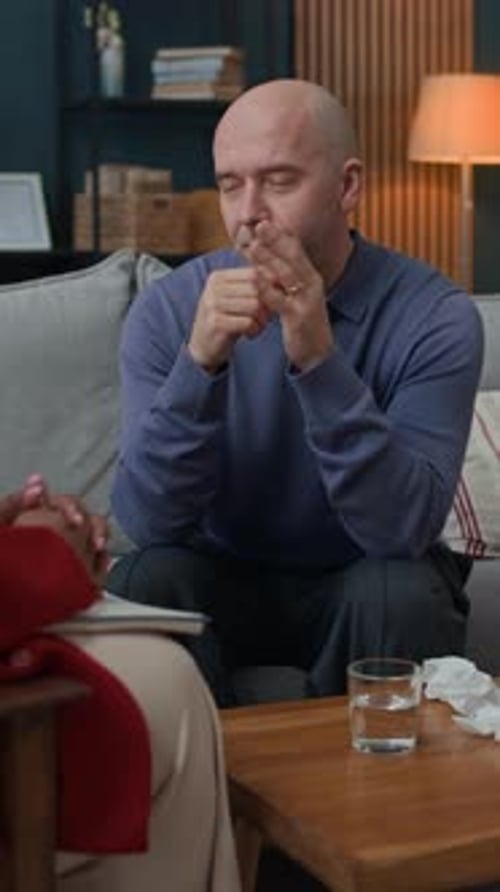 Man Talking in Therapy Session Indoors