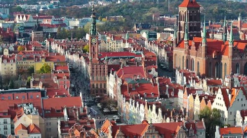 Drone shot of old town in Gdansk, Poland with St. Mary's Church and Town Hall in the background