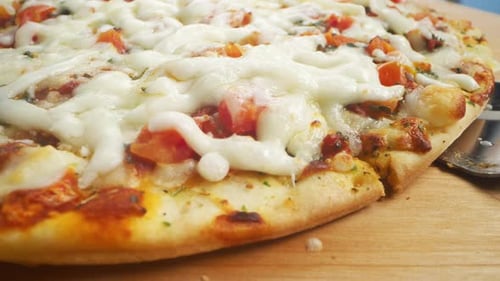 Slice Of Pizza Is Lifted From Board With Cheese Stretching, Slow Motion.