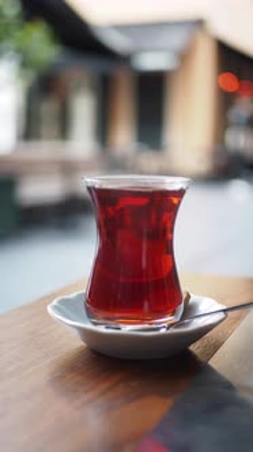 Enjoying a Warm Beverage in a Cozy Cafe Setting