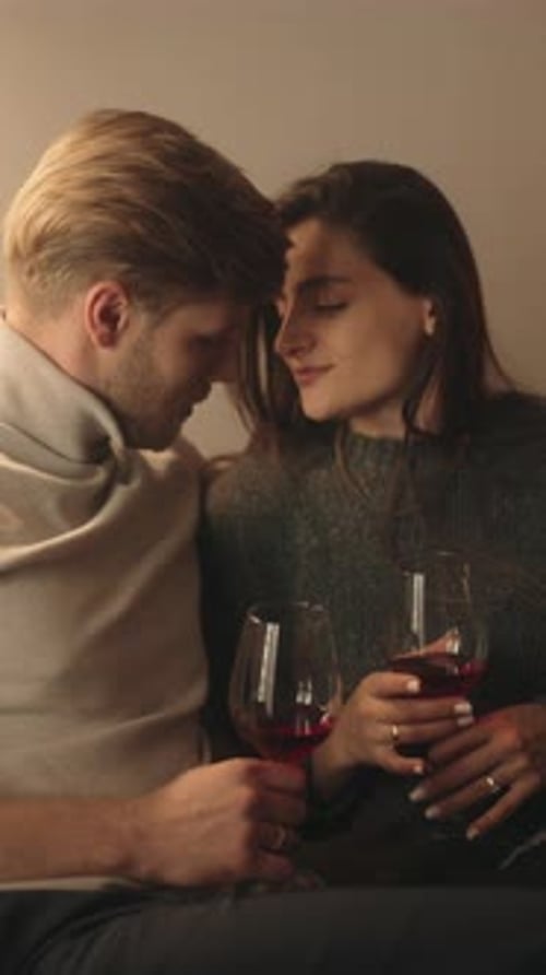 Romantic Couple Celebrating with Wine at Home