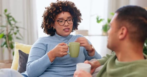 Woman and Man Chatting Over Coffee at Home