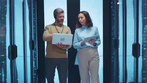 Business Professionals Are Actively Collaborating Together in a HighTech Environment Today