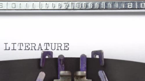 Literature word close up being typing and centered on a sheet of paper on old vintage typewriter