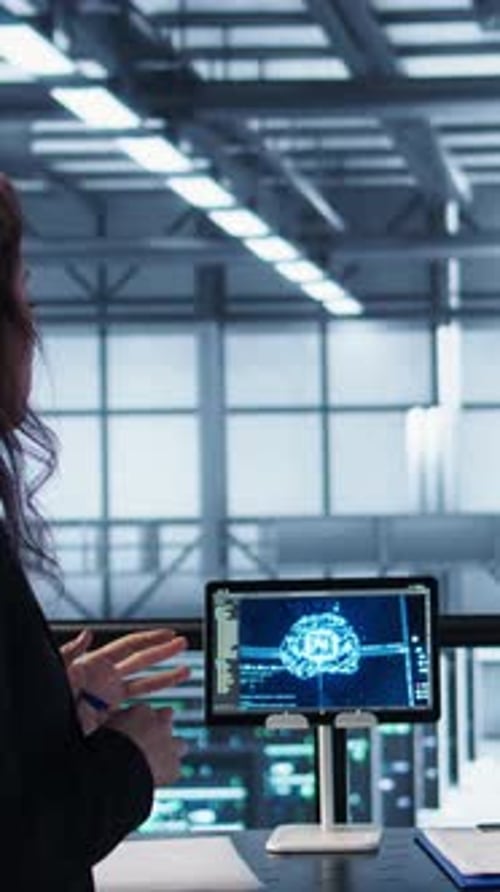 Vertical Video Team of Engineers in Data Center with Tablet Integrating AI Automation Tools
