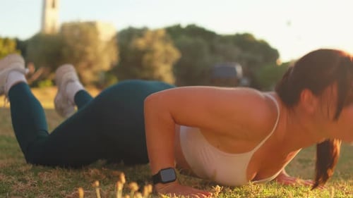 Woman Stretching and Doing Yoga in City Park