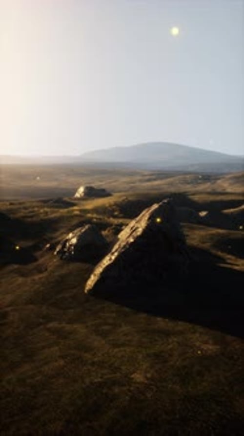 Grassy Plain With Distant Hill