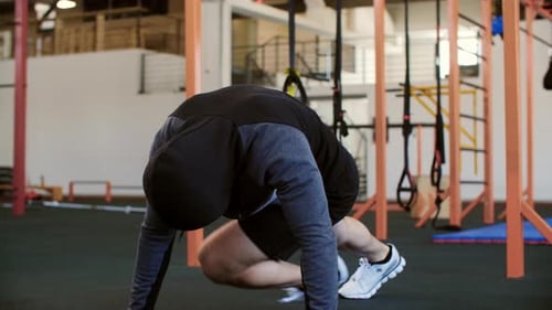 Sportsman Doing Mountain Climber Exercise at Gym