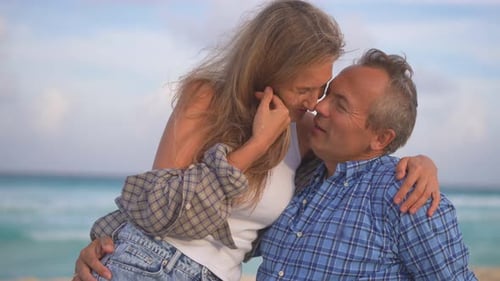Romantic Middleaged Couple Enjoying a Peaceful Evening Together on the Beach Love Connection and