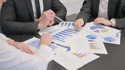 Close up of Business People Working on Documents