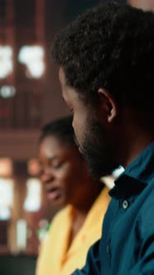 Vertical Video Black College Students Comparing Their Class Notes at the University Library