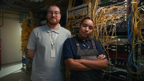 Server Workers Stand in a Tech Workspace