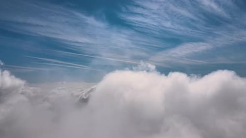 Aerial View of Fluffy White Clouds and Blue Sky