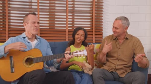 Family Fun: Girl, Men Singing, Playing Music Together