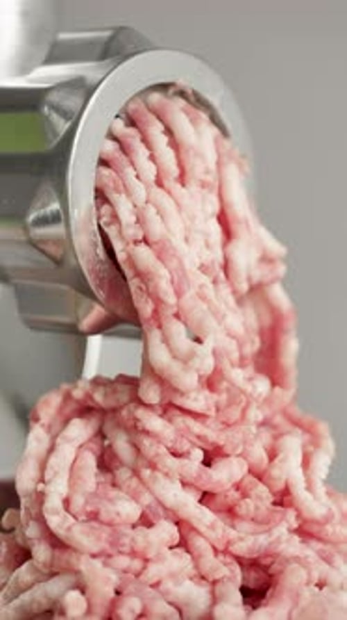 Vertical video using a meat grinder to obtain minced meat with a high content of pork fat. Processin