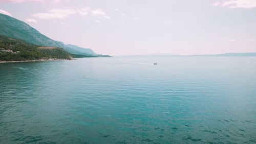 Serene Boat Ride on the Calm Sea Waters Along Makarska Riviera in Croatia. Peaceful coastal scenery