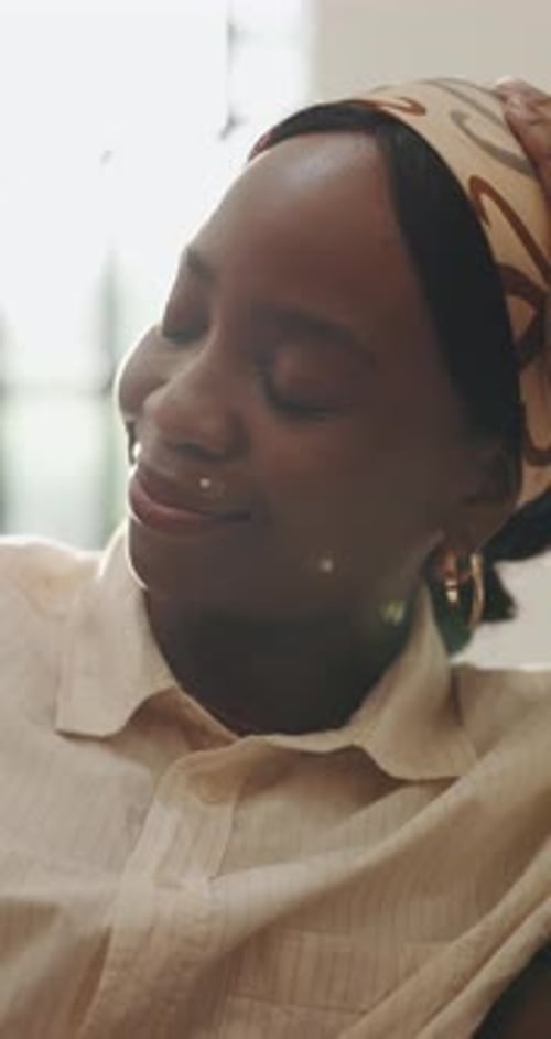 Relax, thinking and black woman in lounge, wellness and smile with ideas, memory and remember