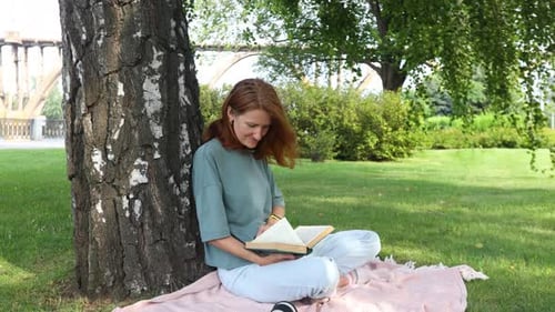 Woman Reading In A Park 19