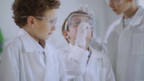 Children Conduct Science Experiment in a Lab