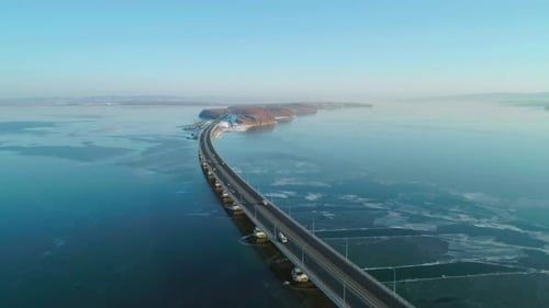 Aerial Drone View of Lowwater Bridge Across the Bay with Moving Car Active Movement of Transport