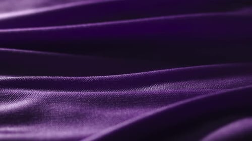 Close Up Shot of Rippling Purple Silk Fabric