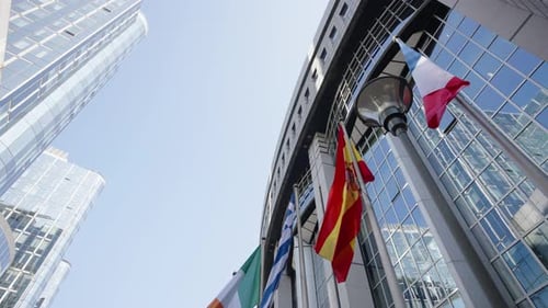 Modern Glass Building with flags of European nations