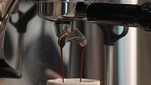 Close Up of Espresso Pouring into Mug