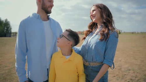 Happy Adorable Caucasian Loving Family Couple Male Man Father Woman Mother Female Parents Hugging